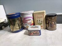 Front view of five tins