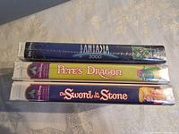 Spine view of three sealed Disney VHS tapes