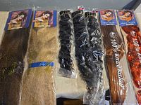 All seven sealed packs on table