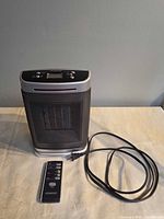 Front view of Kenwood space heater with power cord and remote
