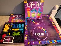 Box, open game board, instruction manual and components overview