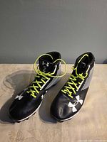 Front/top view of both cleats showing laces, logos and overall condition