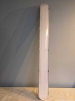 Front view of 4-ft vapor-tight LED fixture showing diffuser