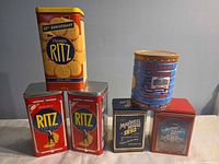 Front view showing all six tins arranged