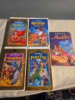 Front covers of all five Walt Disney VHS tapes