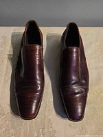 top view of both loafers showing creasing and overall style