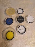 Six plastic cases with filters visible