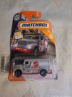 Front of sealed Matchbox blister card showing International Armored Truck model