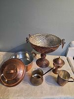 overall view of compote, lidded pot, cezve, goblet, mugs