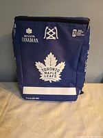 Front view of blue and white Molson Canadian Toronto Maple Leafs insulated backpack cooler