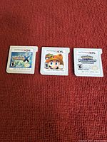 Front view of the three Nintendo 3DS cartridges showing titles and ESRB rating