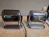 Front view of both chrome toasters