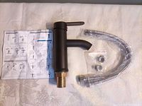 Faucet with manual, hoses, nuts displayed