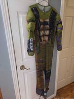 Front view of padded Donatello jumpsuit hanging