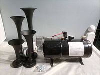 Full view of tank/compressor assembly with four trumpets and hardware