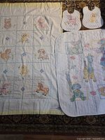 Overview showing both quilts and both bibs