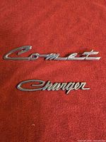 Front view of both chrome script emblems