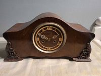 Front view of Forestville wood tambour mantel clock showing dial and case