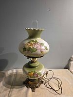 Full view of lamp showing shade, font, base, cord