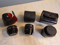 All three lenses with their cases closed