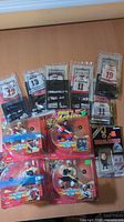 Group shot of all items showing four Pro Action figures, nine McDonald’s jersey stands, Headliners figure