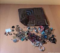 Entire lot laid out: pouch and assorted jewelry