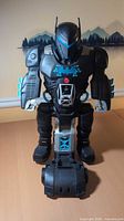 Front view of black Batman Batbot playset standing upright on table