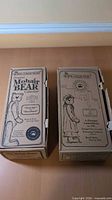 Two Boyds Collection cardboard boxes side by side