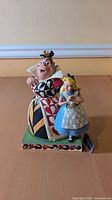 Front view of Alice & Queen of Hearts figurine on base