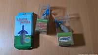 Boxed Master Infuser and two boxed Master Cork stoppers on table