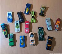 Top-down group shot of all 15 vehicles on tabletop