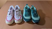 Front view of both sneaker pairs