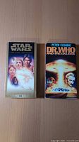 Front view of both VHS tapes, Star Wars Special Edition and Dr. Who and the Daleks
