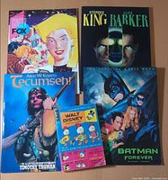 Group shot showing all five books/comics