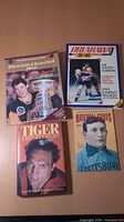 All four sports books laid out