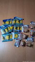 Group of all sealed magnet packs laid out on table: multiple Comic Block sets and Iron Man 3D magnets visible