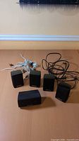 All five Panasonic speakers with wiring visible