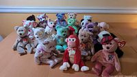 Group shot of all 18 Ty Beanie Babies arranged on table
