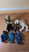Group shot of seven Ty plush bears showing variety of colours and outfits
