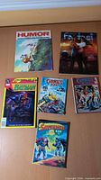 Group view of six Portuguese comics and magazines