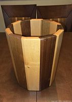 Front view showing two-tone hardwood exterior and octagonal shape