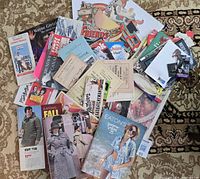 Top-down view of entire lot spread out, showing Eaton’s catalogues, brochures and magazines