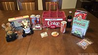 Full lot layout on table showing all Coca-Cola items