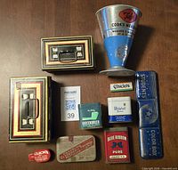 Group shot of all ten tin items arranged on tabletop