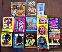 All thirteen sealed movie card packs laid out