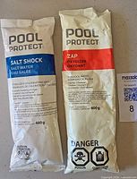 Front view of Pool Protect Salt Shock 480 g and Zap Oxidizer 600 g bags