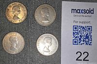 Obverse view of four coins alongside MaxSold lot number