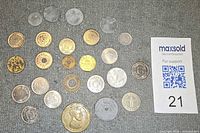 Overview of all tokens and coins laid out on surface