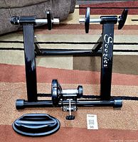 Trainer stand front view showing Soozier branding and riser block