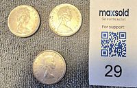 Obverse of three Canadian silver dollar coins